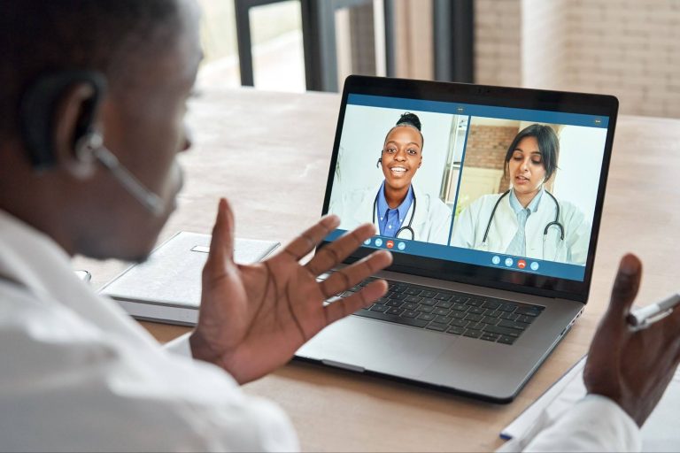 remote medical director reviewing clinical operations digitally